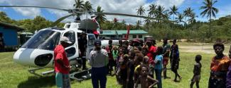 AFMA fisheries officer visits PNG via helicopter
