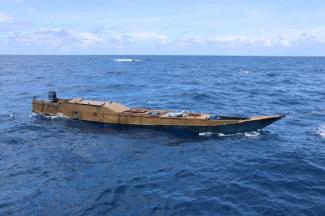 A long narrow Indonesian boat at sea
