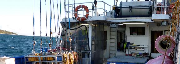 Boat with deep sea fishing equipment